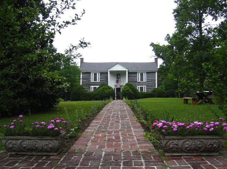 Historic homestead with brick walkway